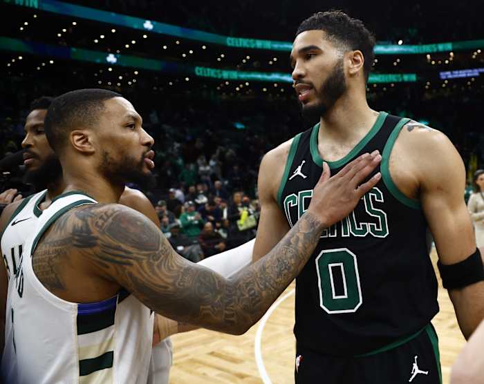 Boston Celtics forward Jayson Tatum (0) and Milwaukee Bucks guard Damian Lillard (0) 